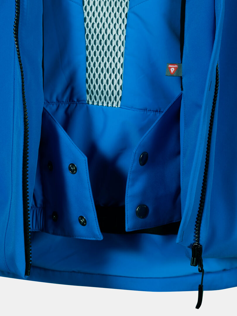 Close-up of Halti Vertica DX Ski Jacket Men's blue mesh lining, buttons, zippers, and small tag.