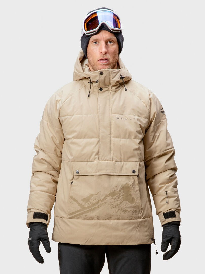 A man wears the Halti Chowper Ski Anorak, black gloves, and ski goggles, facing forward against a plain background.