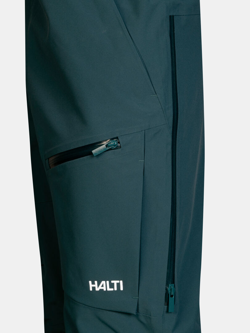 Dark teal Rizle 3L Dx Ski Pants Unisex with a zippered side vent and a thigh pocket.