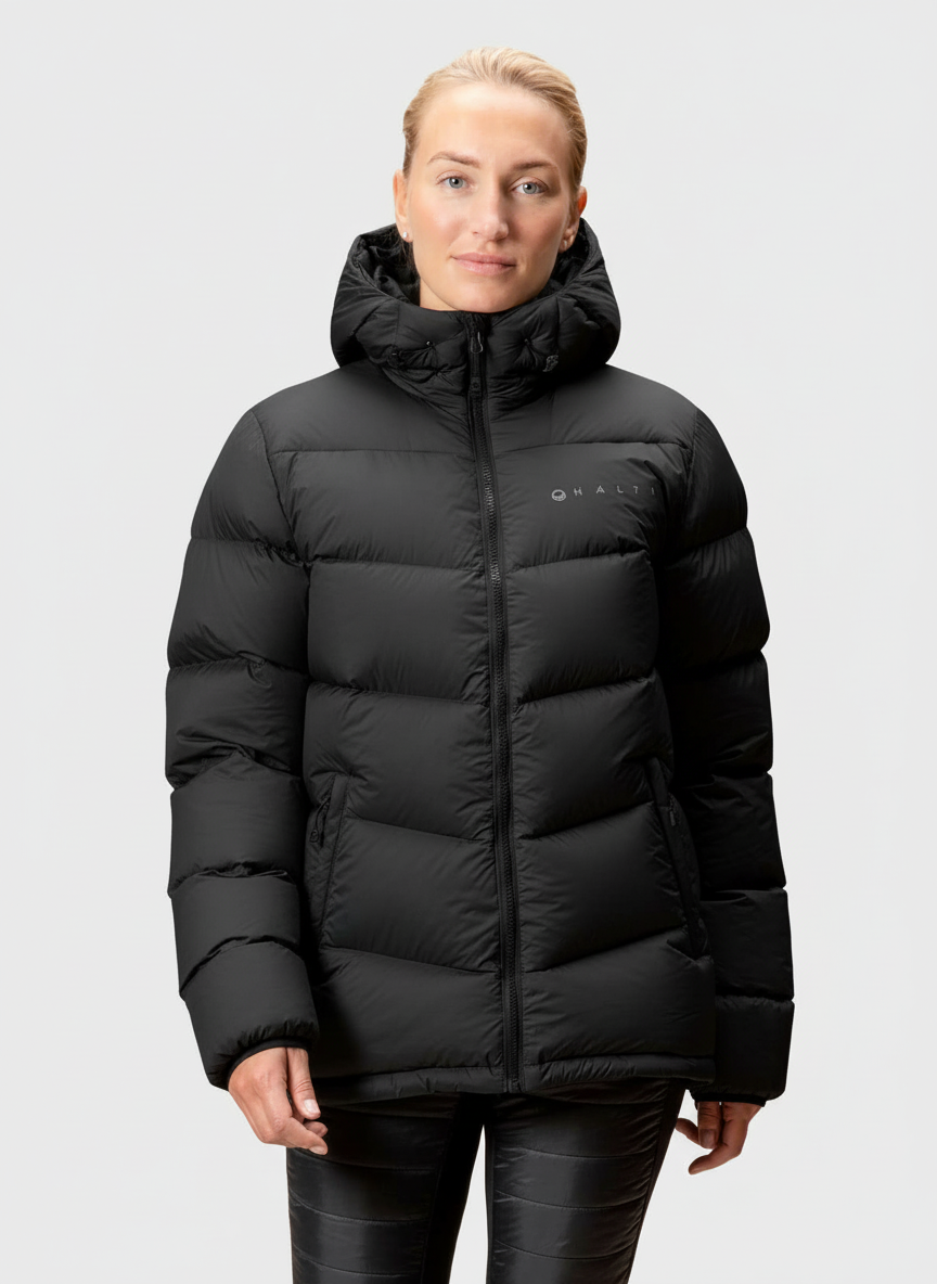 A woman wears the Halti Versant Down Jacket against a plain light gray background.