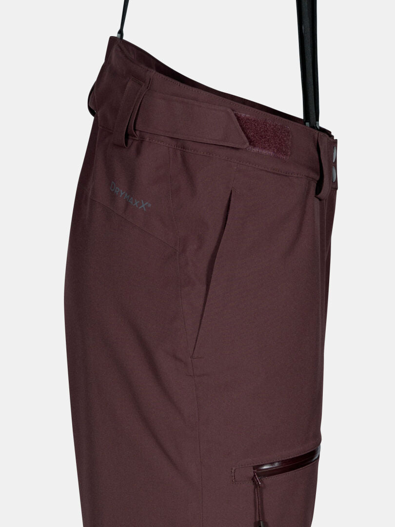Side view of Halti Carvey II DX women's maroon ski pants with zipper pocket, belt loops & Drymaxx logo near pocket.