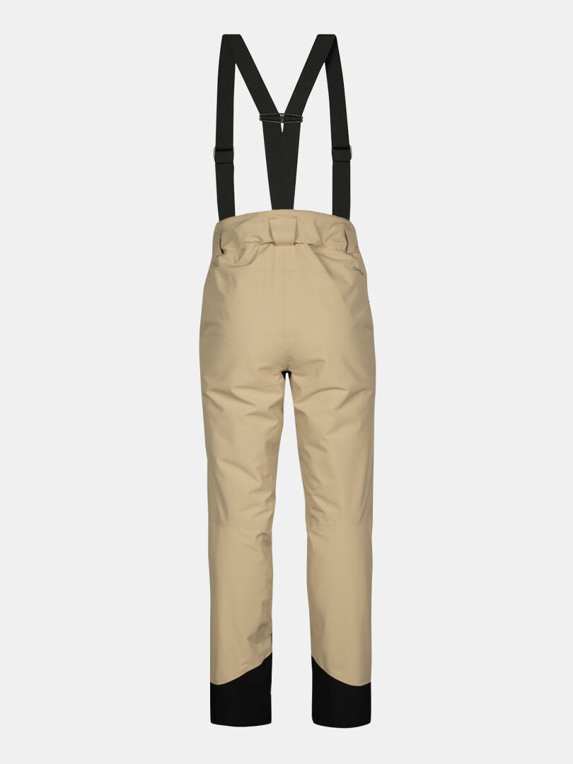 Halti Carvey II DX Women's beige ski pants with black suspenders and cuffs, shown from the back on a white background.