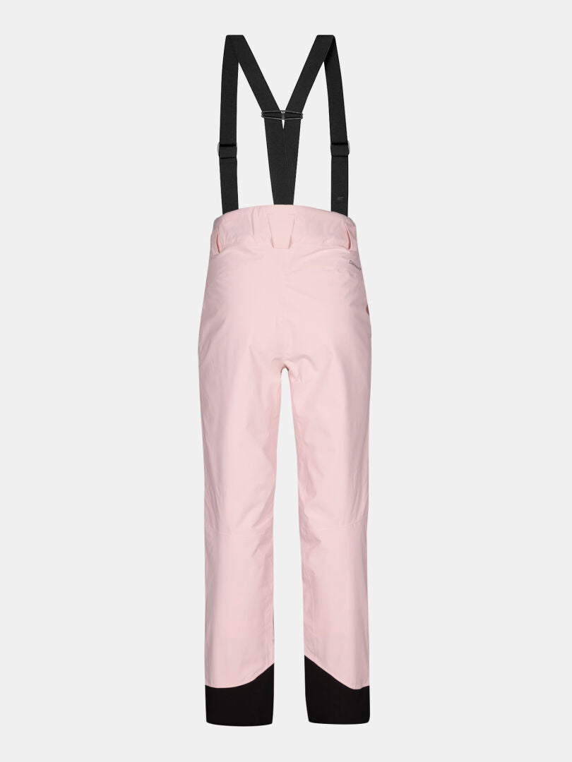 Halti Carvey II DX light pink women's ski pants with black suspenders and reinforced cuffs on a white background.
