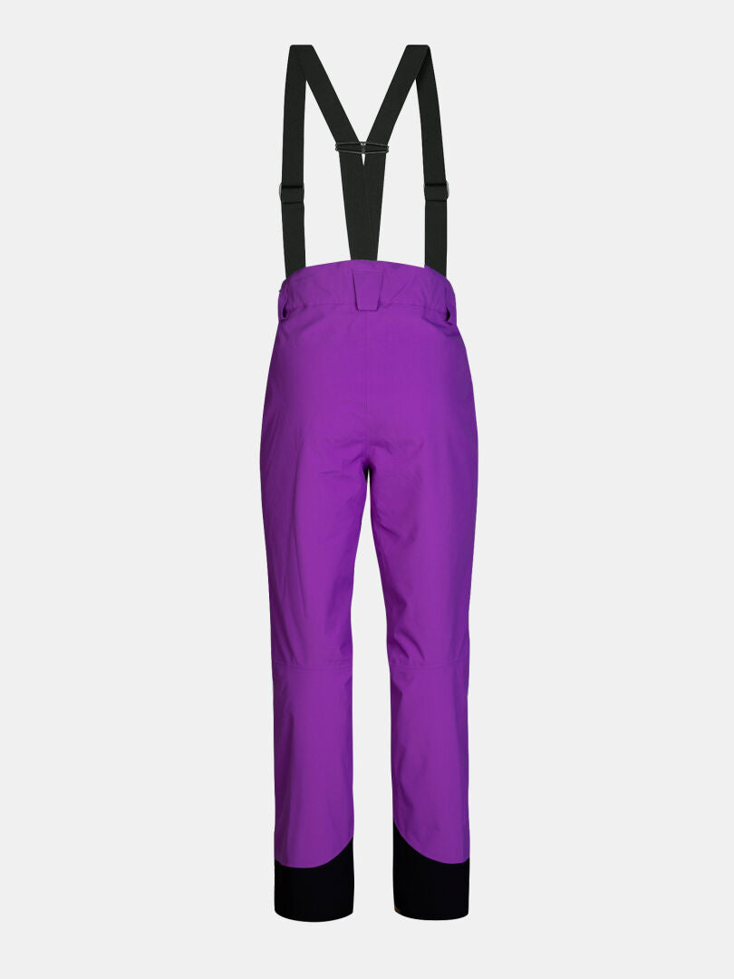 Back view of purple Carvey II DX Ski Pants Women’s with black suspenders and black ankle cuffs.