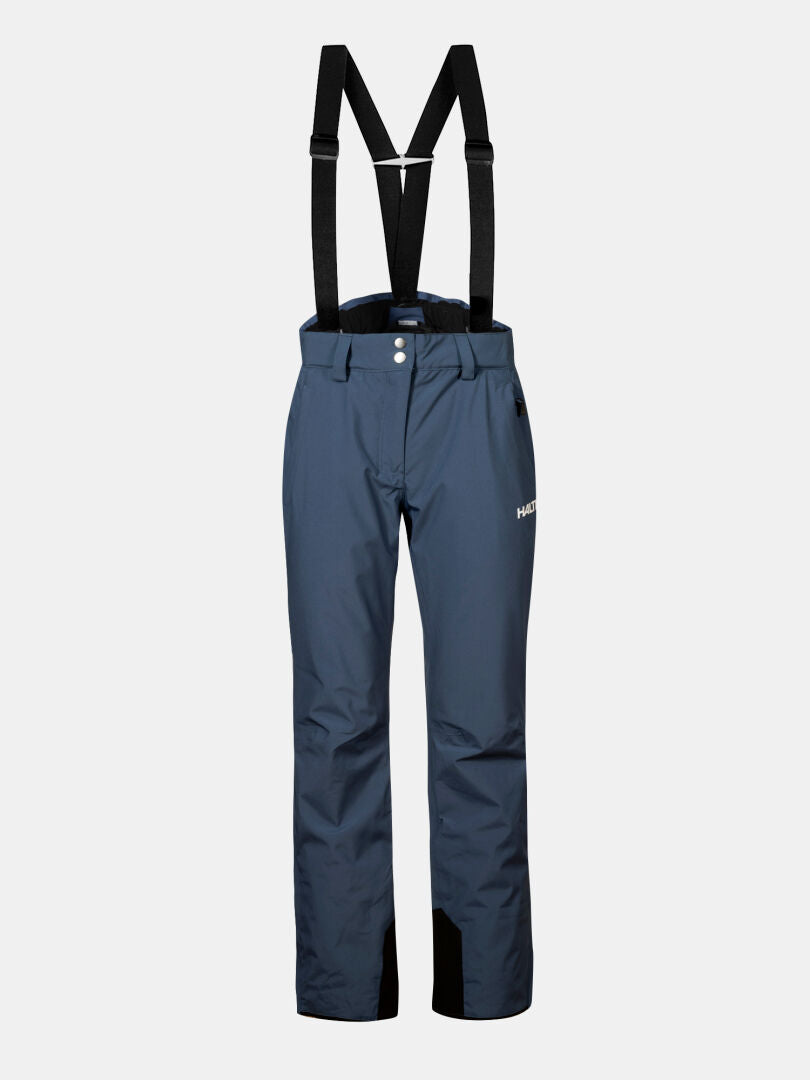 Halti Glades II DX Women's ski pants in navy with black suspenders, front buttons, and a white logo on the left thigh.