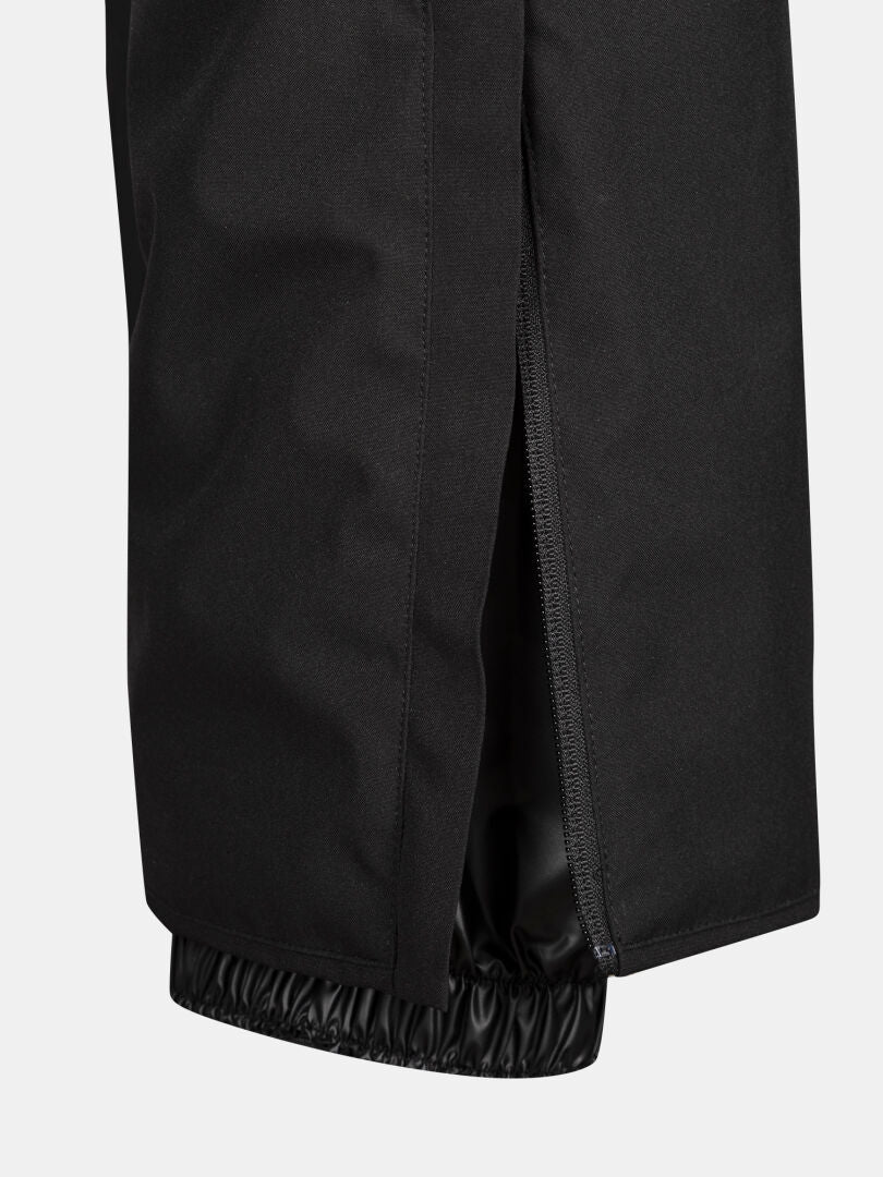Close-up of Halti Glades II DX Women's Ski Pants in black, showing side zipper and elastic cuff detail.