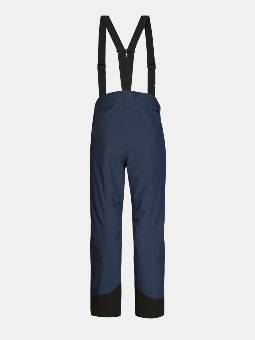 Rear view of navy blue Halti Carvey II DX Ski Pants Men’s with black suspenders and black reinforced cuffs.