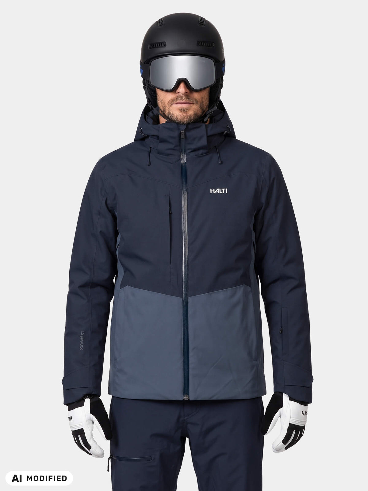 Man in a Halti Recier DX Ski Jacket Men’s, wearing a black helmet and white ski gloves.