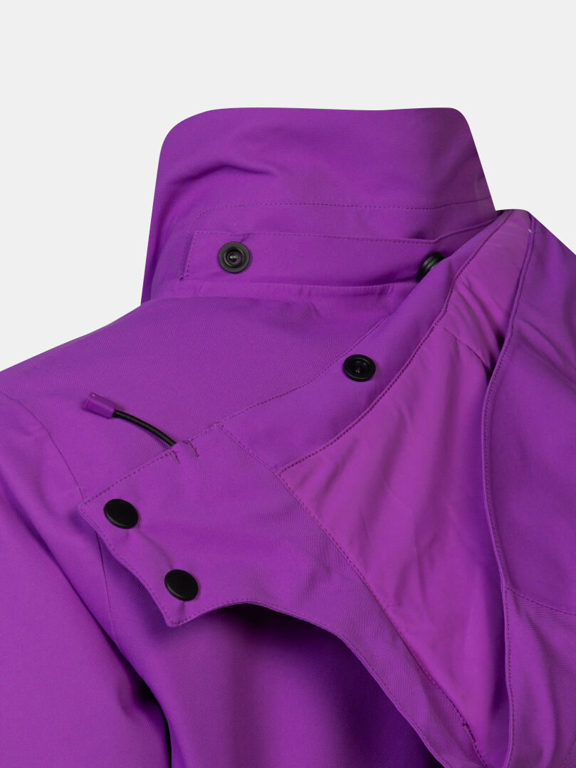 Purple waterproof Halti Recier DX Ski Jacket Women’s with a detachable hood and snap-button collar.