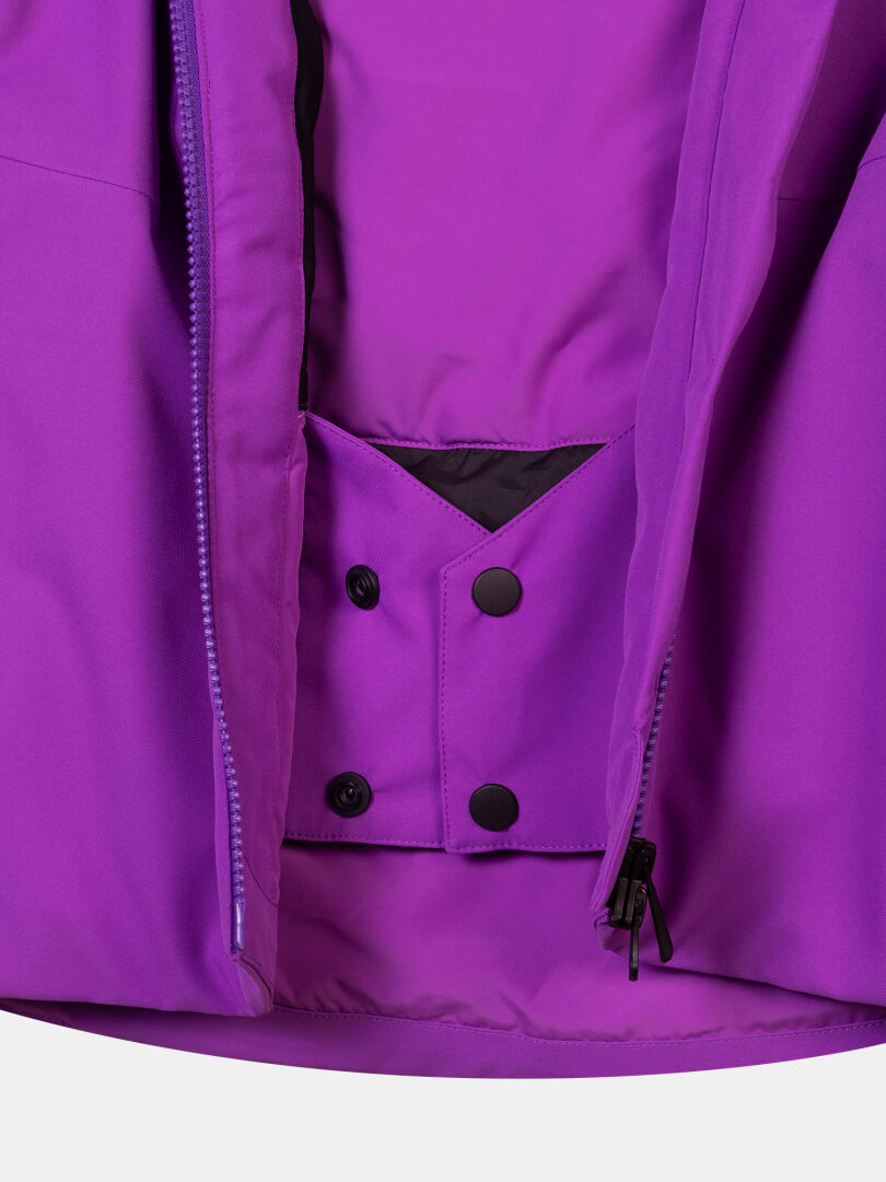 Purple waterproof Recier DX Ski Jacket Women’s showing the interior snow skirt with snap button closures.