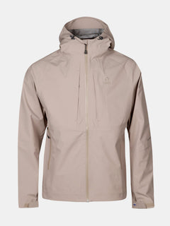 Halti Kaarna Mens DX 3L Shell Jacket in beige with chest pockets, front zipper, hood, and subtle left chest logo.