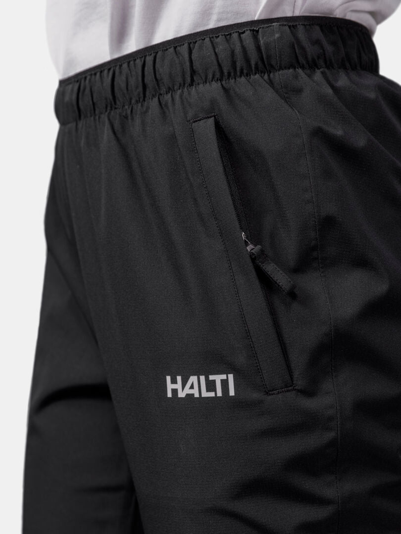 Close-up of Halti Forter DX Shell Pants Women's, featuring a zip pocket for outdoor weather protection.