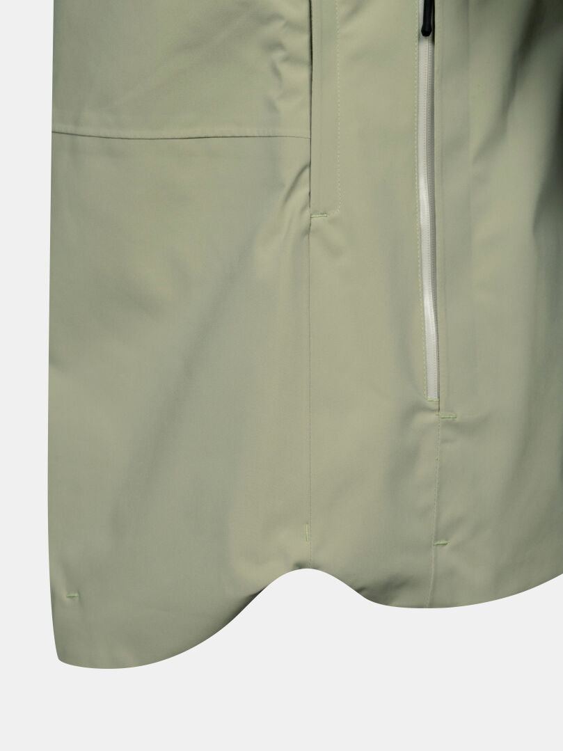 Close-up of the Halti Staala DX Shell Jacket Women’s in light green with water-repellent fabric and a white zipper.