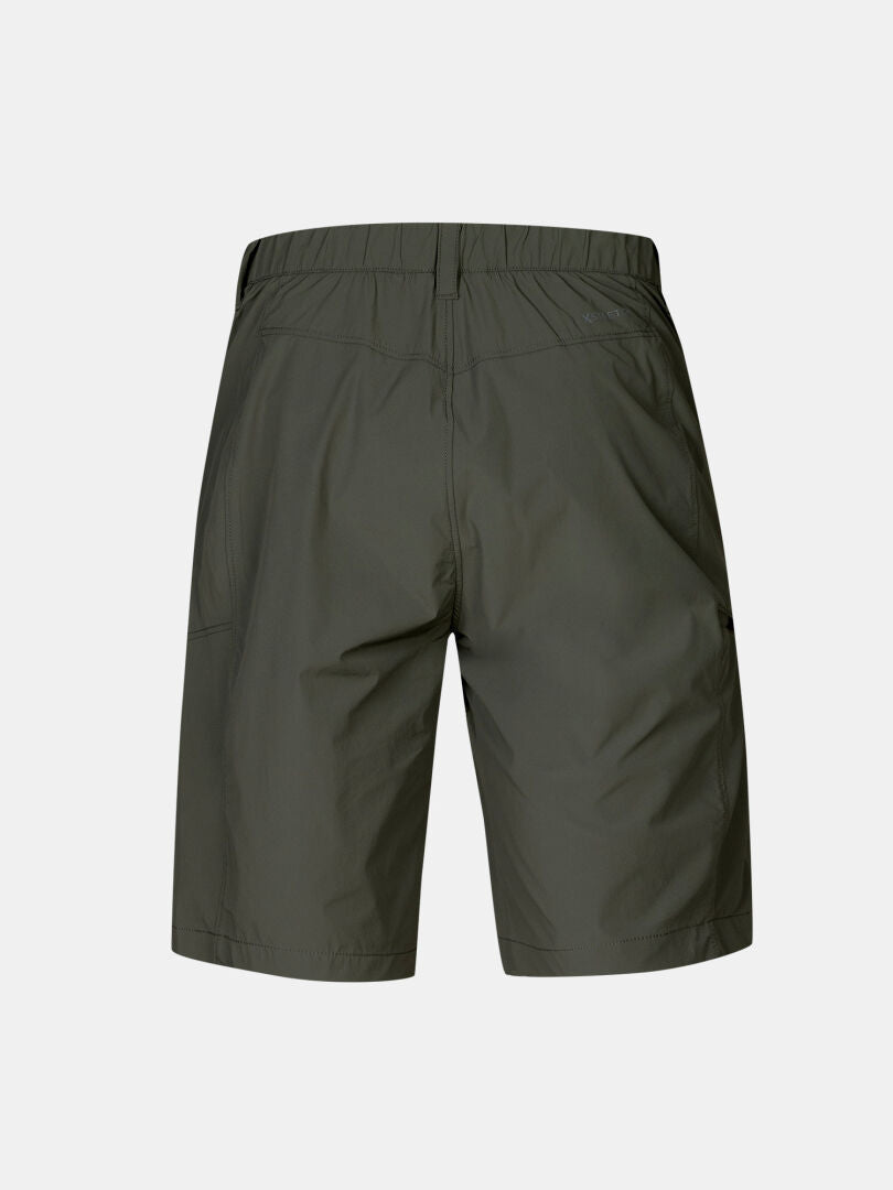 Back view of Halti Pallas Cool X-stretch Shorts Men's in dark green, featuring an elastic waistband, on plain background.