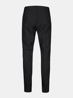Back view of Halti Finholma X-stretch Men’s Pants in black with elastic waist and slim, tapered legs on grey background.