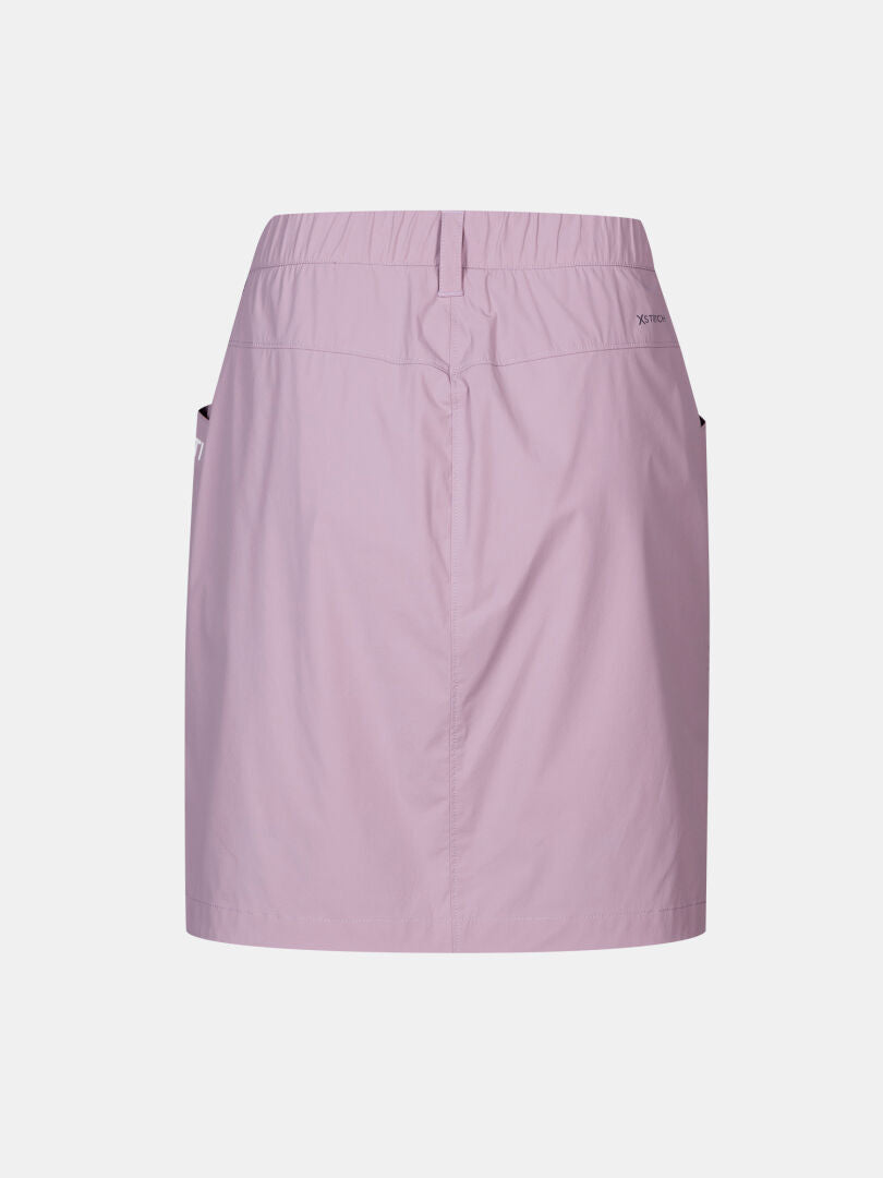 Halti Pallas Cool Skort Women's in light purple, back view, with elastic waist, side pockets, and quick-drying fabric.