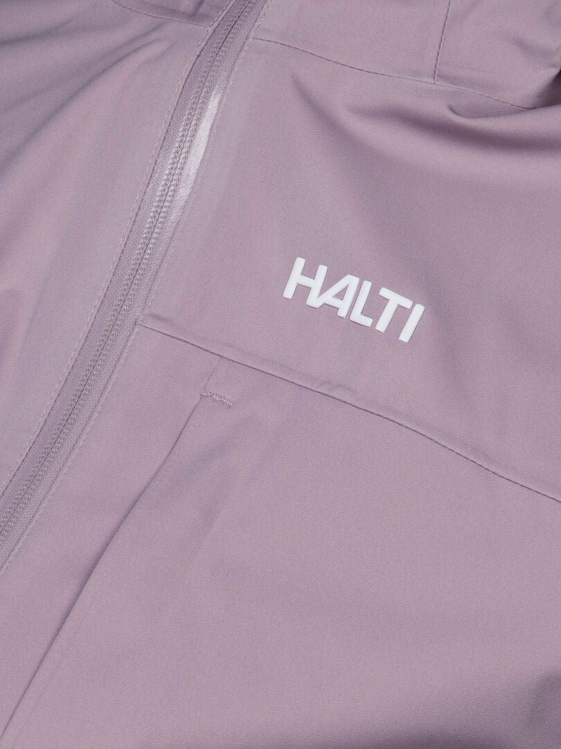 Close-up of the Taival DX 3L women's jacket by Halti in light purple with a zipper and white HALTI logo on the chest.