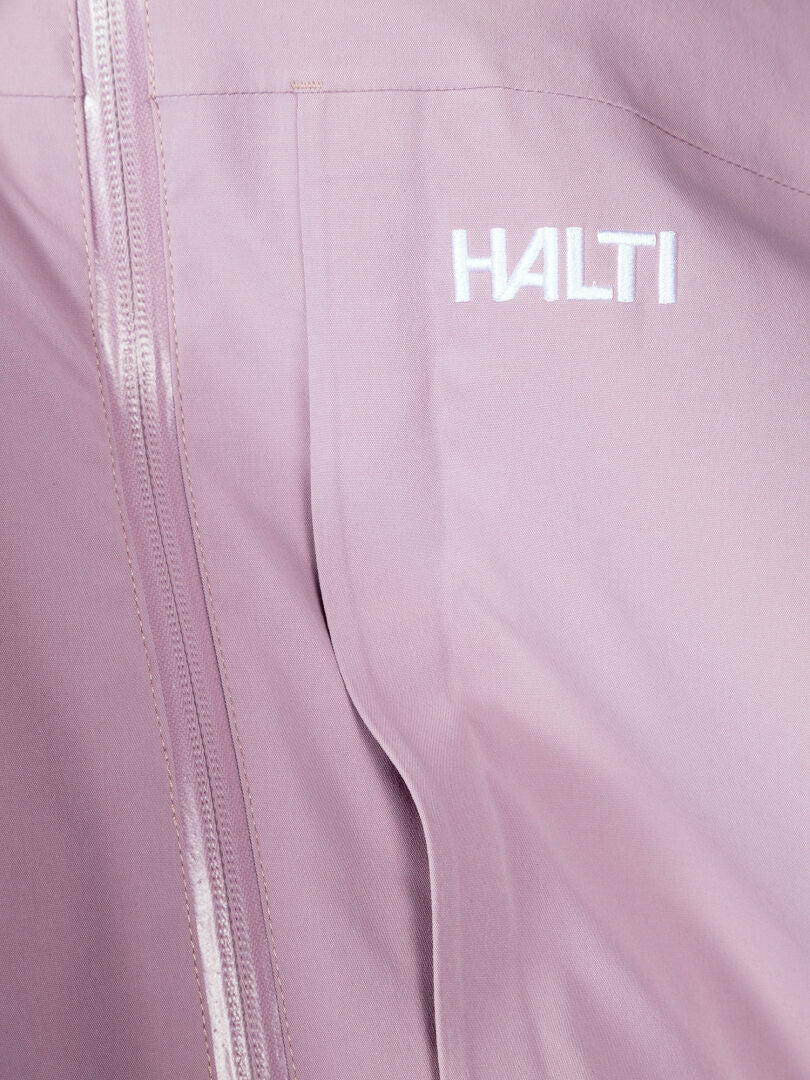 Close-up of Halti Valaja DX Parka Jacket Women's Plus in light pink with zipper, DrymaxX membrane, and chest logo.
