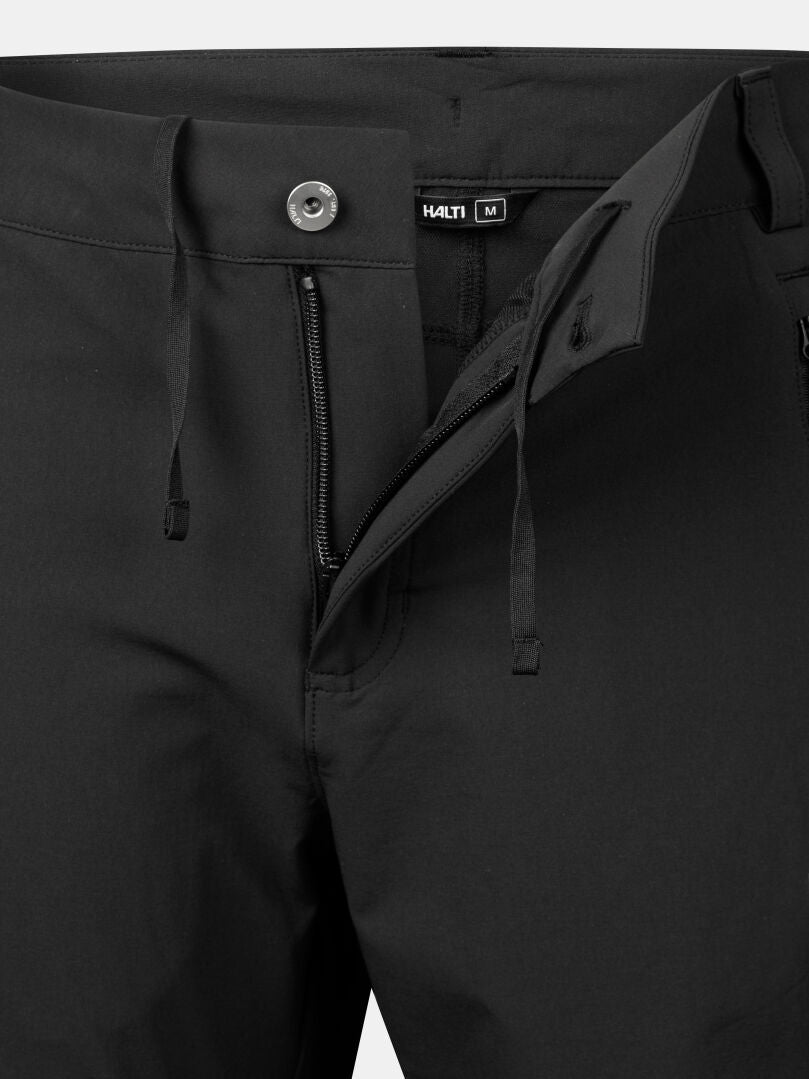 Close-up of Halti Pallas X-stretch Men's pants in durable, breathable fabric with zipper, button, drawstrings, and label.