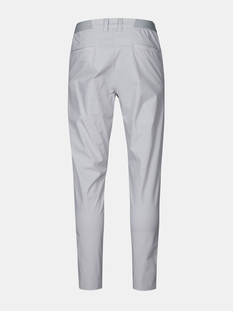 Back view of Halti Drive X-stretch Chinos for men in light gray, with belt loops, welt pockets, and quick-dry stretch fabric.