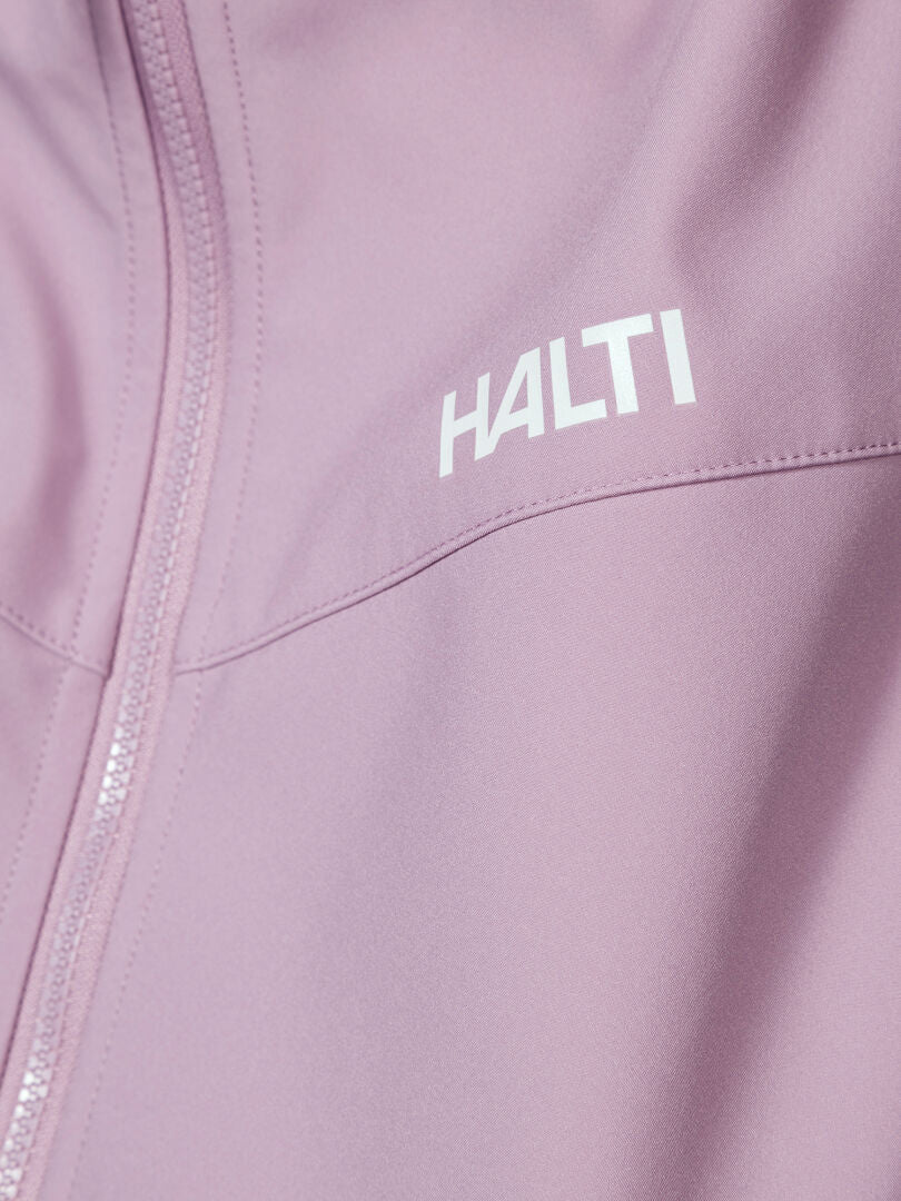 Close-up of Halti Wedge Softshell Jacket Women's, a lightweight windproof jacket with white chest branding and zipper.