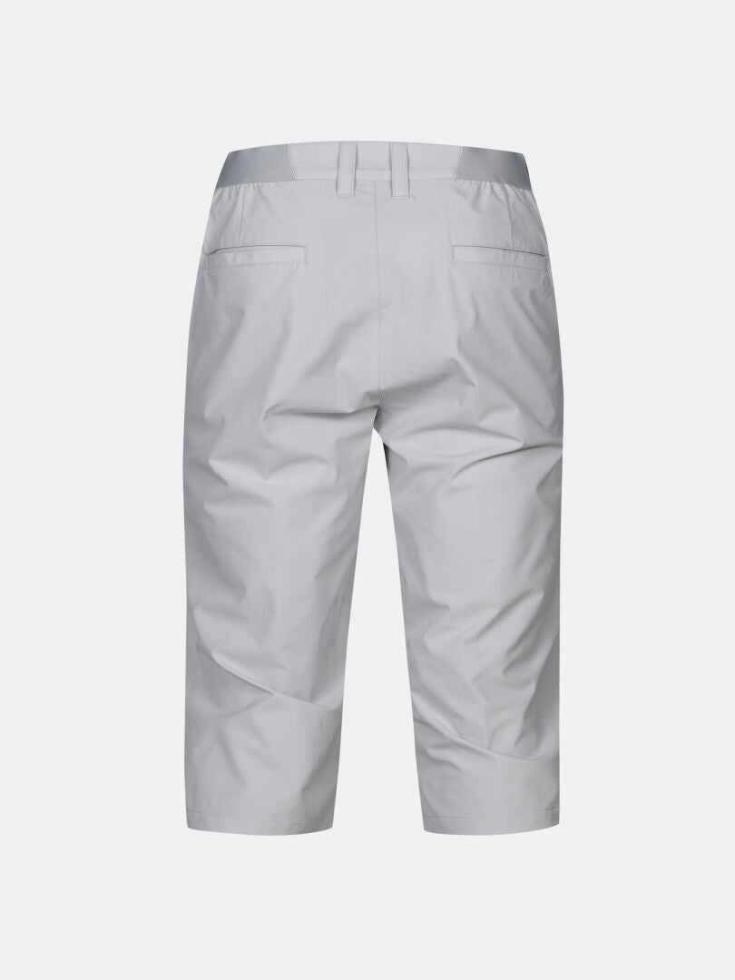 Back view of Halti Drive X-stretch Capri Pants Men's in light gray, with belt loops and two back pockets on a plain background.