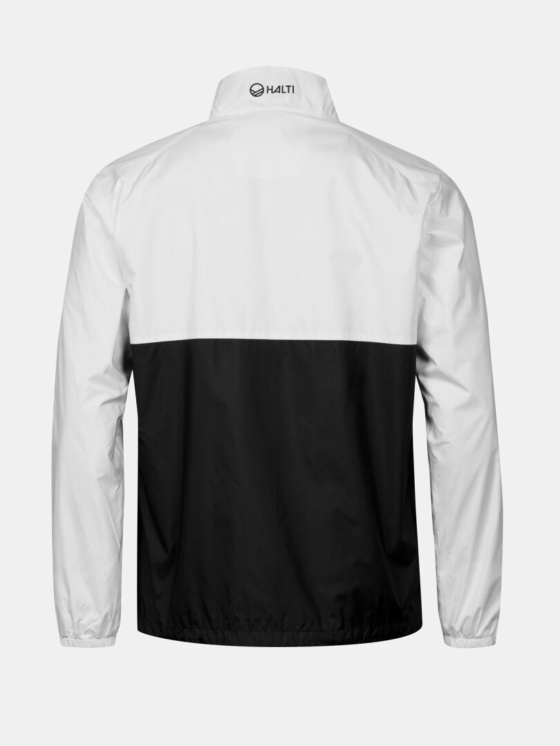 The Halti Saime Windbreaker Jacket Men's has a white top, black bottom, elastic cuffs, and a logo on the upper back.