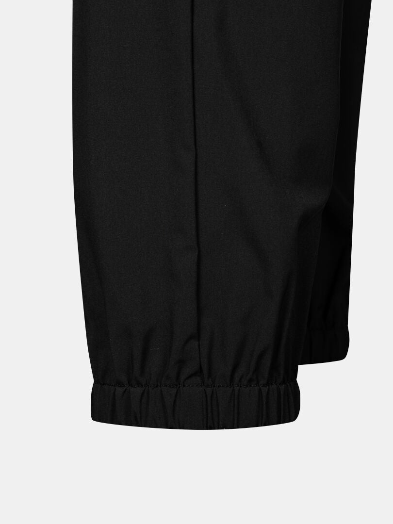 Close-up of Halti Grets Jogger Pants Women's, featuring elastic cuffs, against a plain light background.