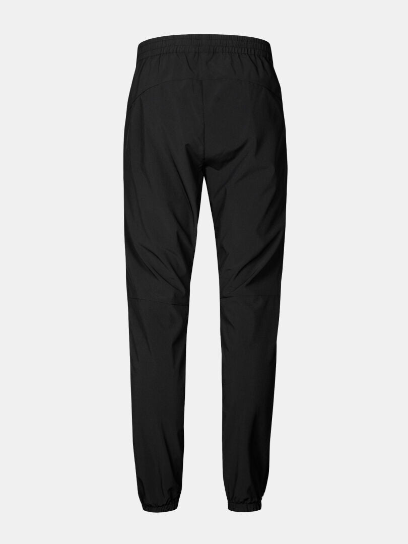 Halti Grets Jogger Pants Men's in black, quick-dry stretch fabric, shown from the back on a light gray background.