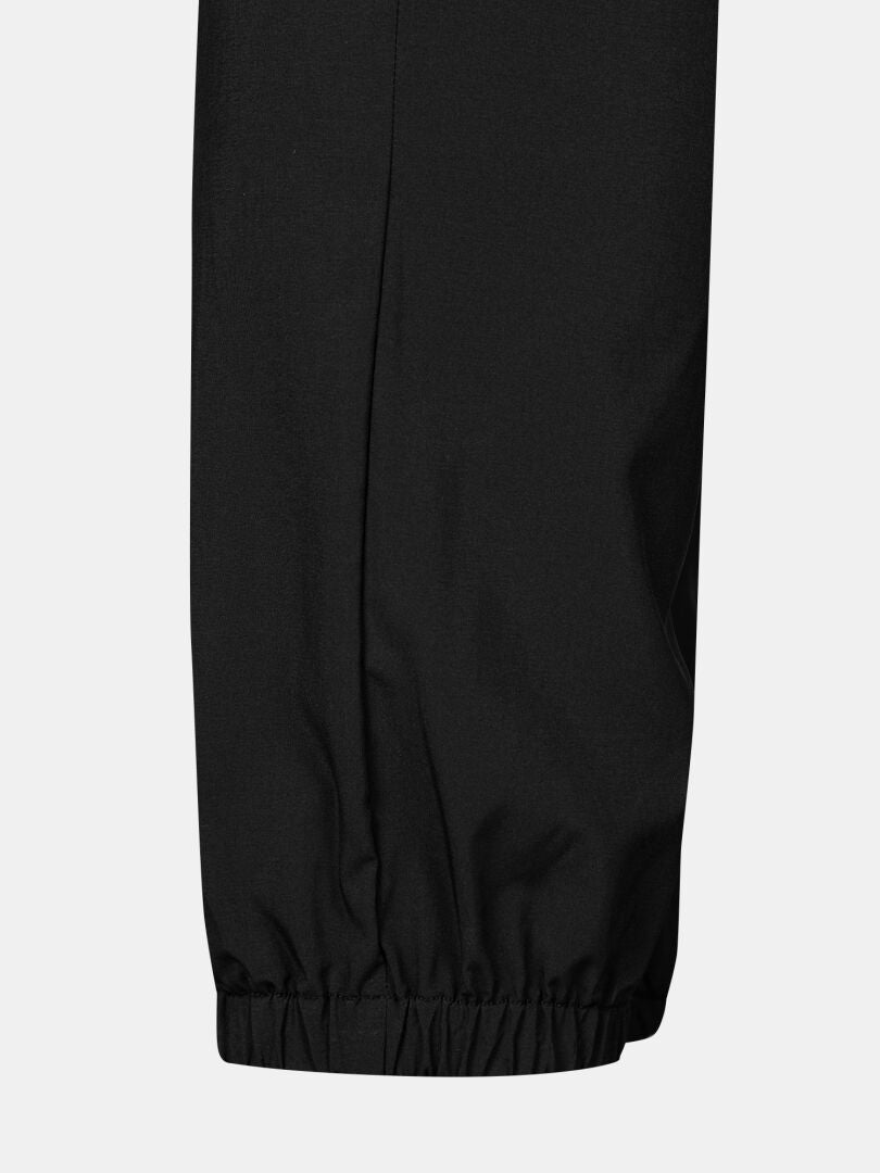 Close-up of Halti Grets Jogger Pants Men's in quick-dry stretch fabric with elastic cuff, shown against a light background.