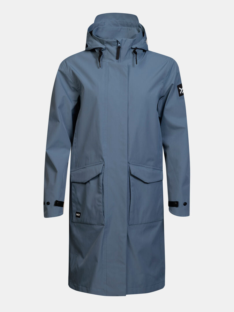 Halti Tokoi II DX Parka Jacket Women’s: long blue raincoat with flap pockets, black snaps & DrymaxX shell patch.