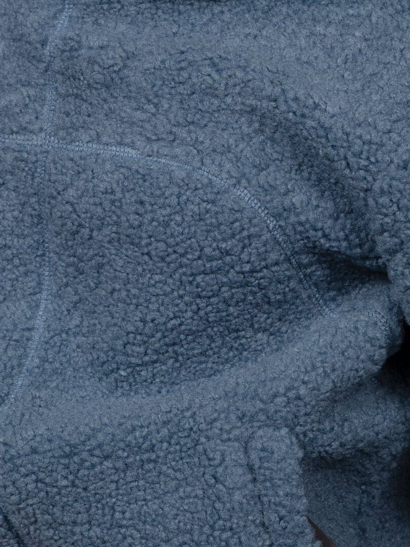 Close-up of Halti Lykky Fleece Jacket Women’s—blue, plush texture with visible seams, ideal for daily wear.