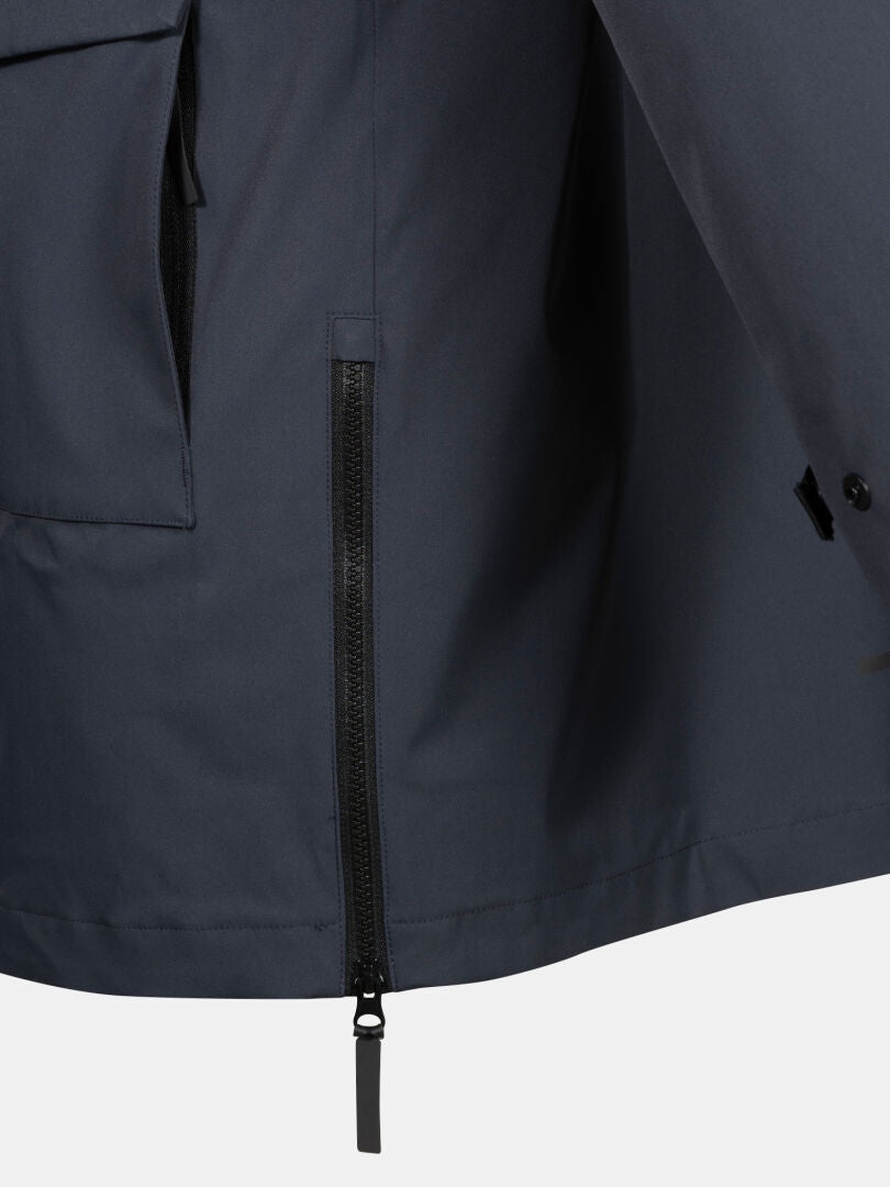 Close-up of Halti Synkas II 3in1 DX Parka Men's, with navy waterproof shell, side zipper, and upper flap pocket.