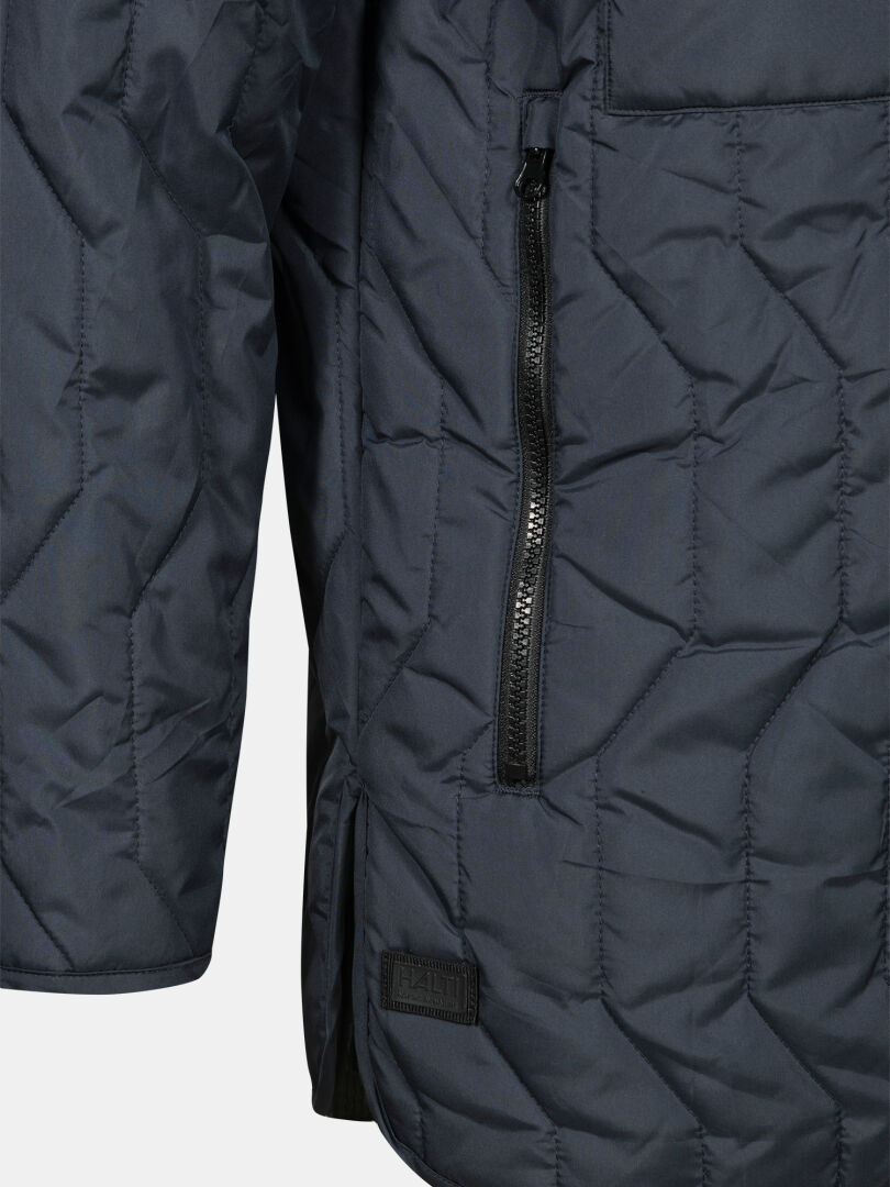 Close-up of Halti Synkas II 3in1 DX Parka Men's with quilted insulated inner layer and visible zipper pocket.