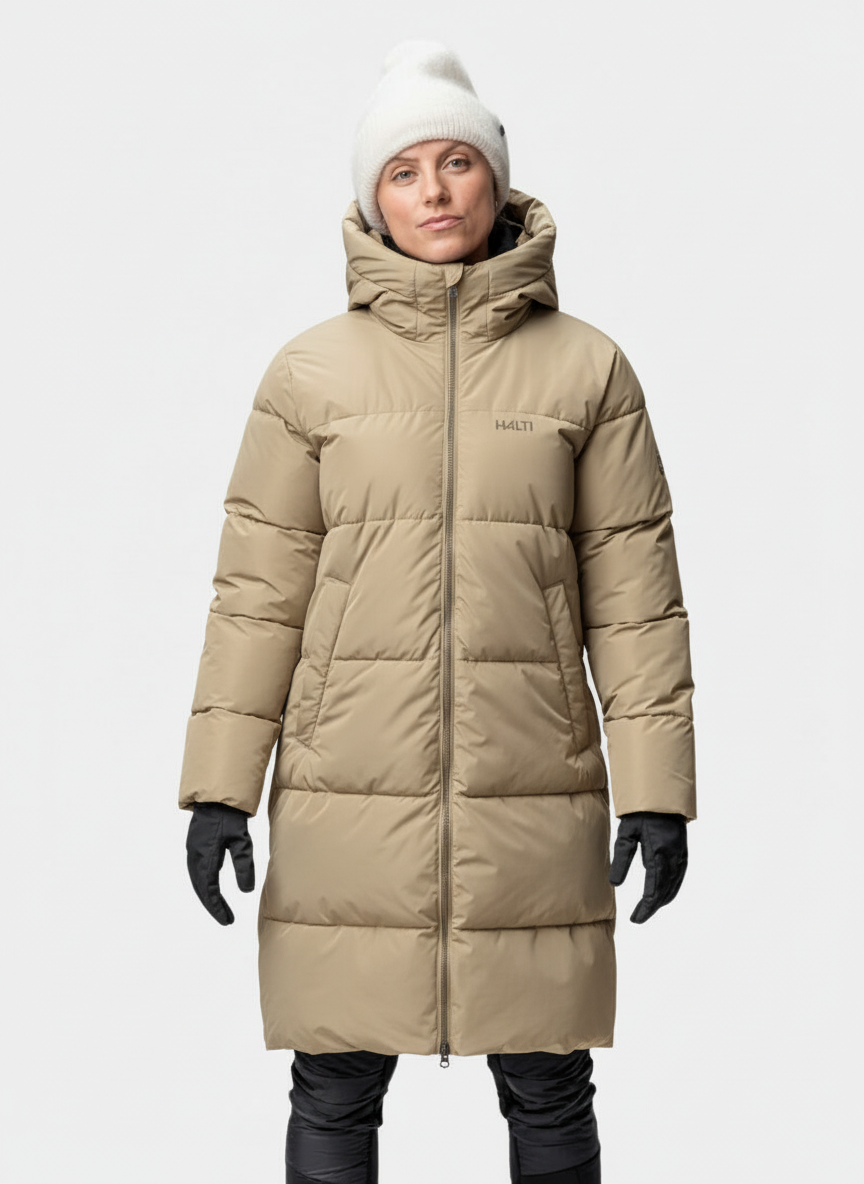 Person wearing a beige Halti Sammal Insulated Parka Jacket, white beanie, and black gloves.