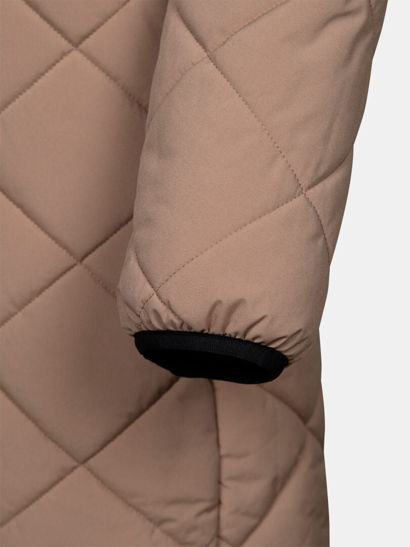Close-up of Haapa Quilted Coat Jacket Women’s by Halti: tan sleeve with black elastic cuff trim.