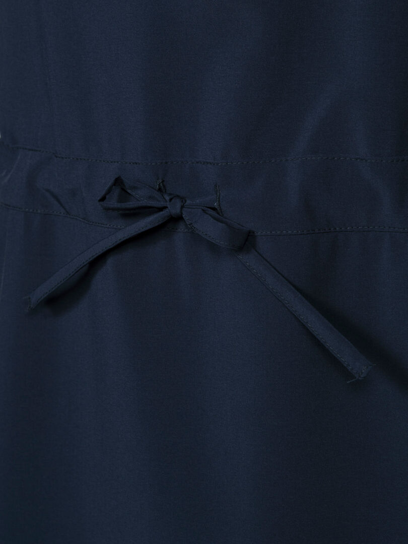 Close-up of Halti Chipper II X-stretch Dress Women's in navy with quick-dry stretch fabric and stitched waistband with bow.