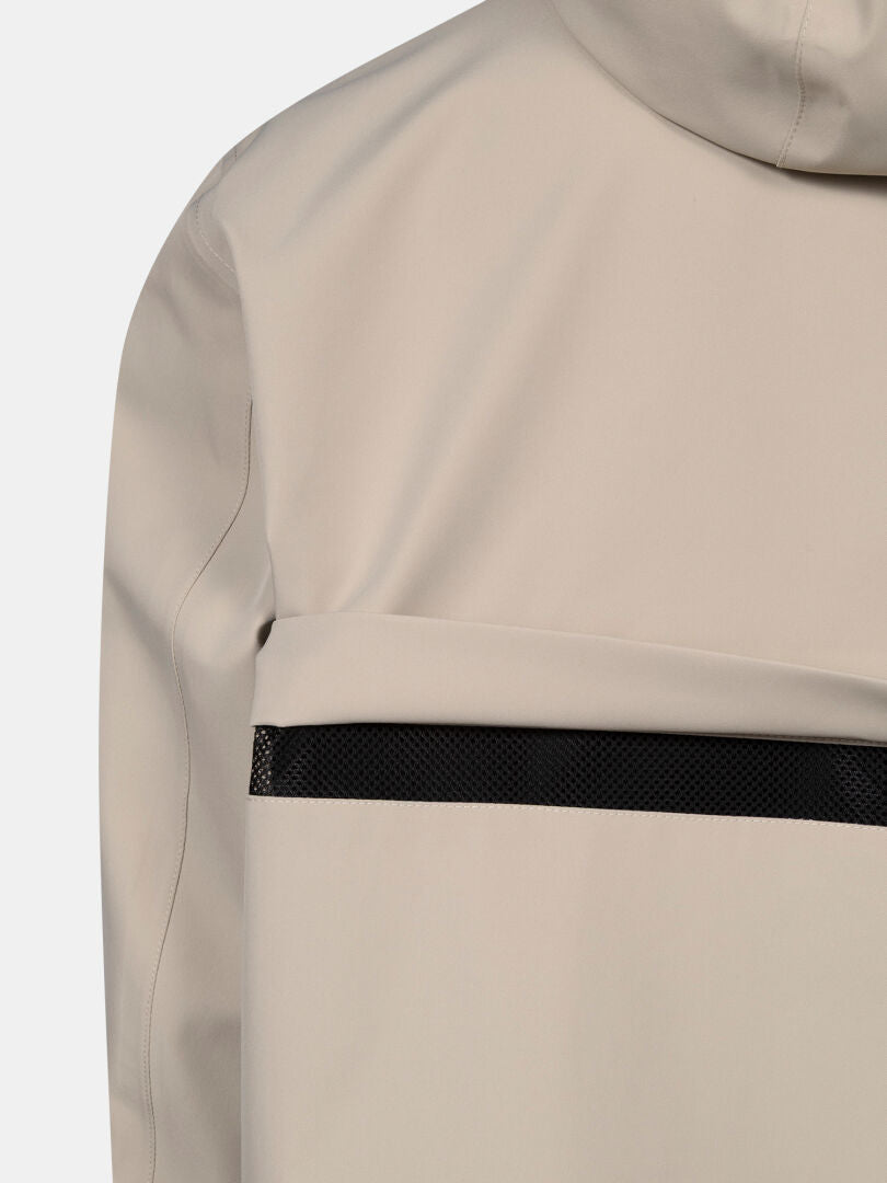 Close-up of the back of the Halti Tokoi DX Jacket Men's in beige, featuring a black mesh strip across the upper section.