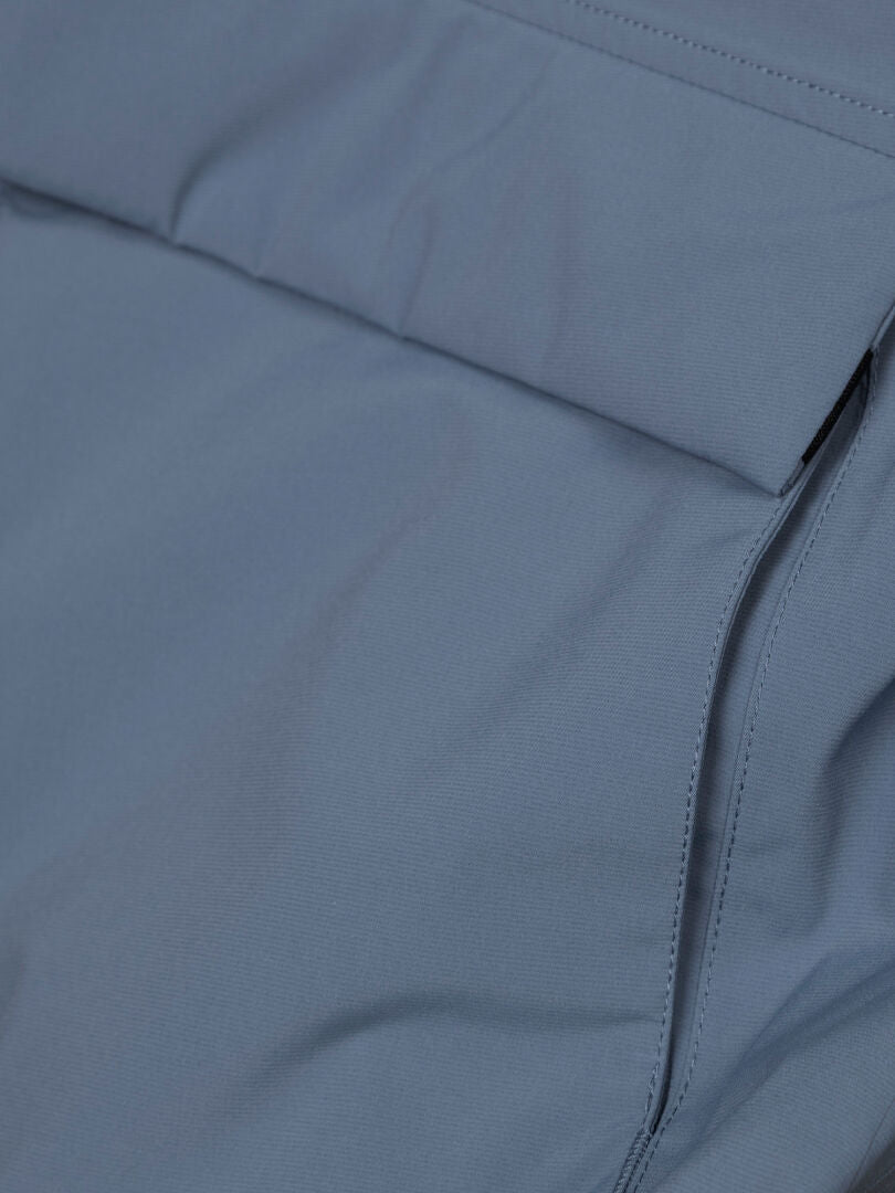 Close-up of Halti Kortteli DX Insulated parka fabric, showcasing the pocket, stitching, and stylish weather protection.