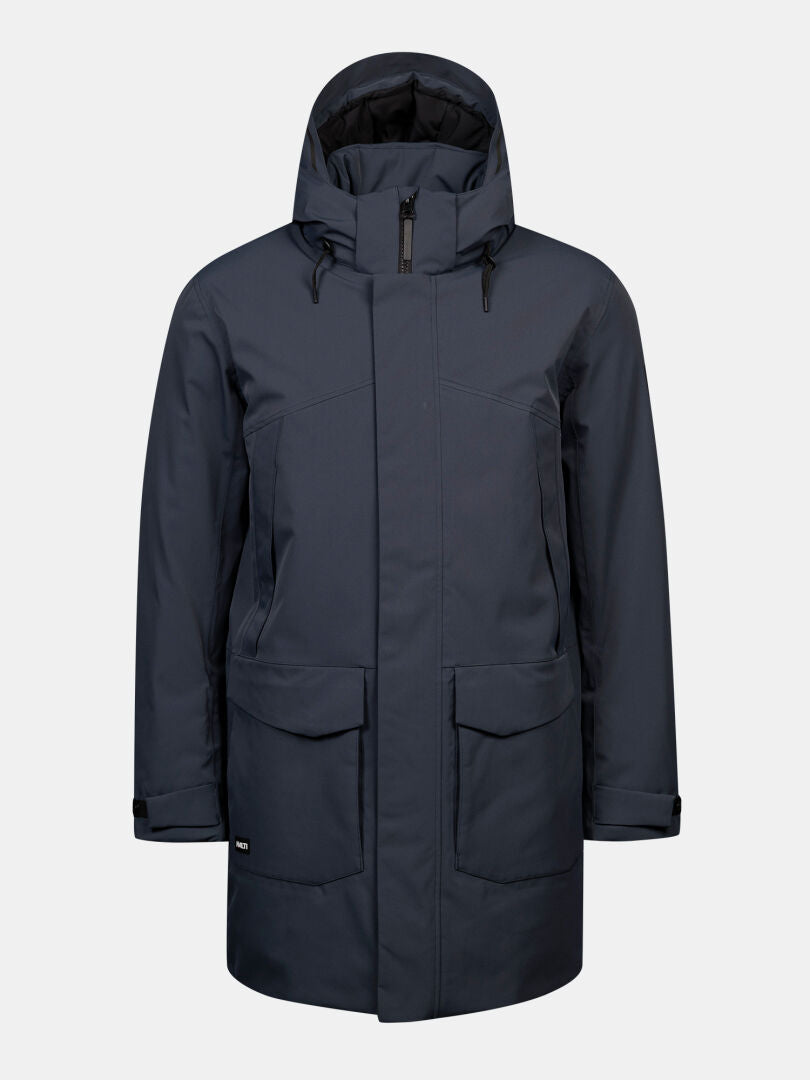 Halti Kallio DX Parka Men’s: dark blue urban winter coat with large pockets, zipper, and adjustable cuffs.