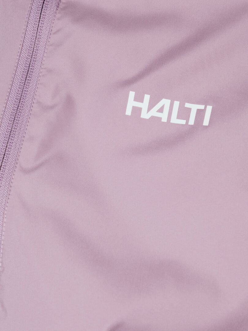 Close-up of the Halti Saime Windbreaker Jacket Women's Plus in mauve with a zipper and white Halti logo.
