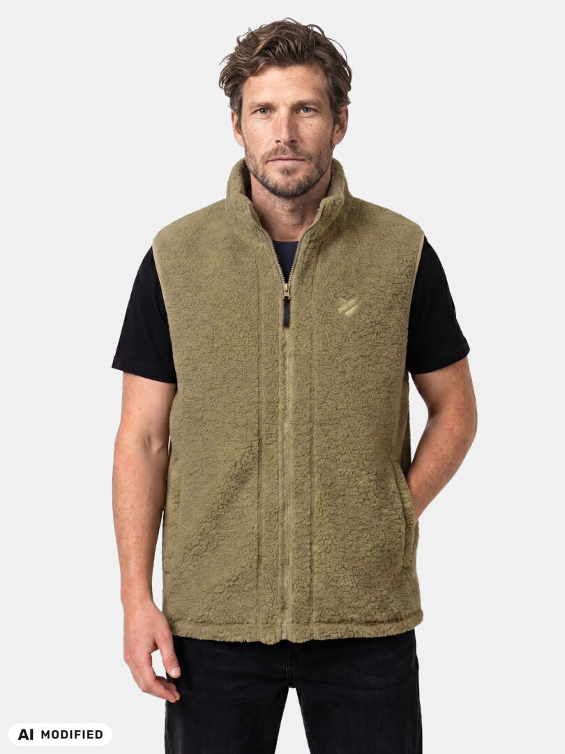 A man wears the Halti Lykky Fleece Vest Unisex in olive green, made from recycled polyester, against a plain background.