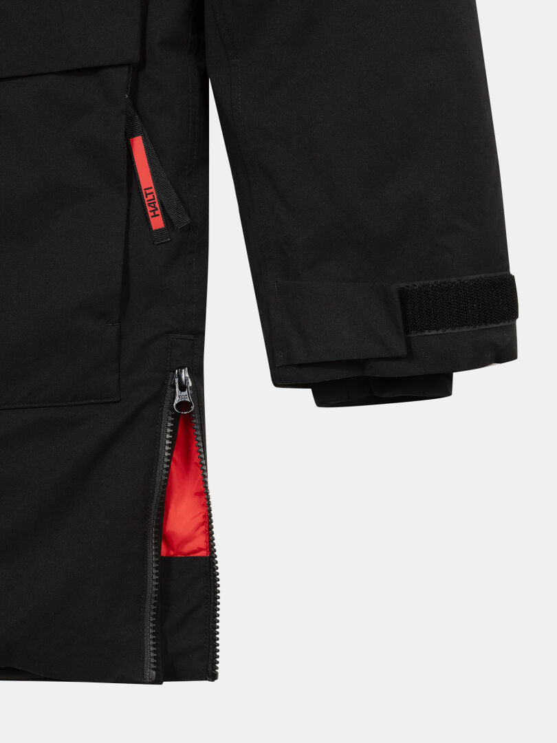 Close-up of Halti 1976 Down Parka Unisex sleeve; zipper, Velcro, and red lining for extreme cold protection.