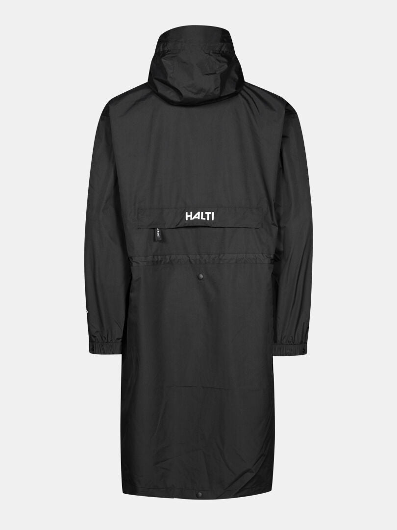 The Halti Coach Jacket is a long black waterproof shell with an adjustable hood, long sleeves, and bold white HALTI branding.