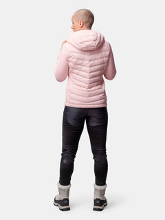 Person facing away in Halti Huippu Hybrid Down Jacket Womens, black pants, gray boots against white background.