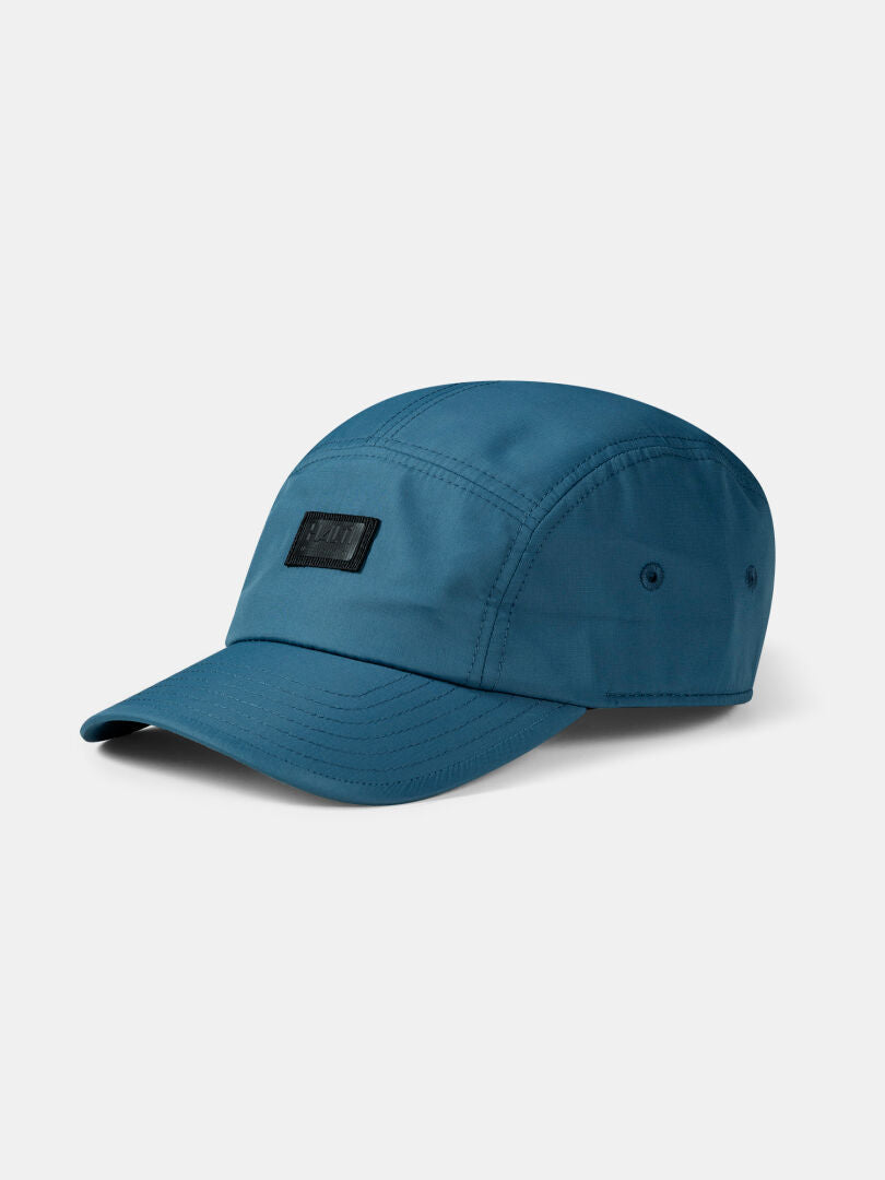 The Halti Staffas Cap is a teal unisex sporty cap with a curved brim and black patch, ideal for summer adventures.
