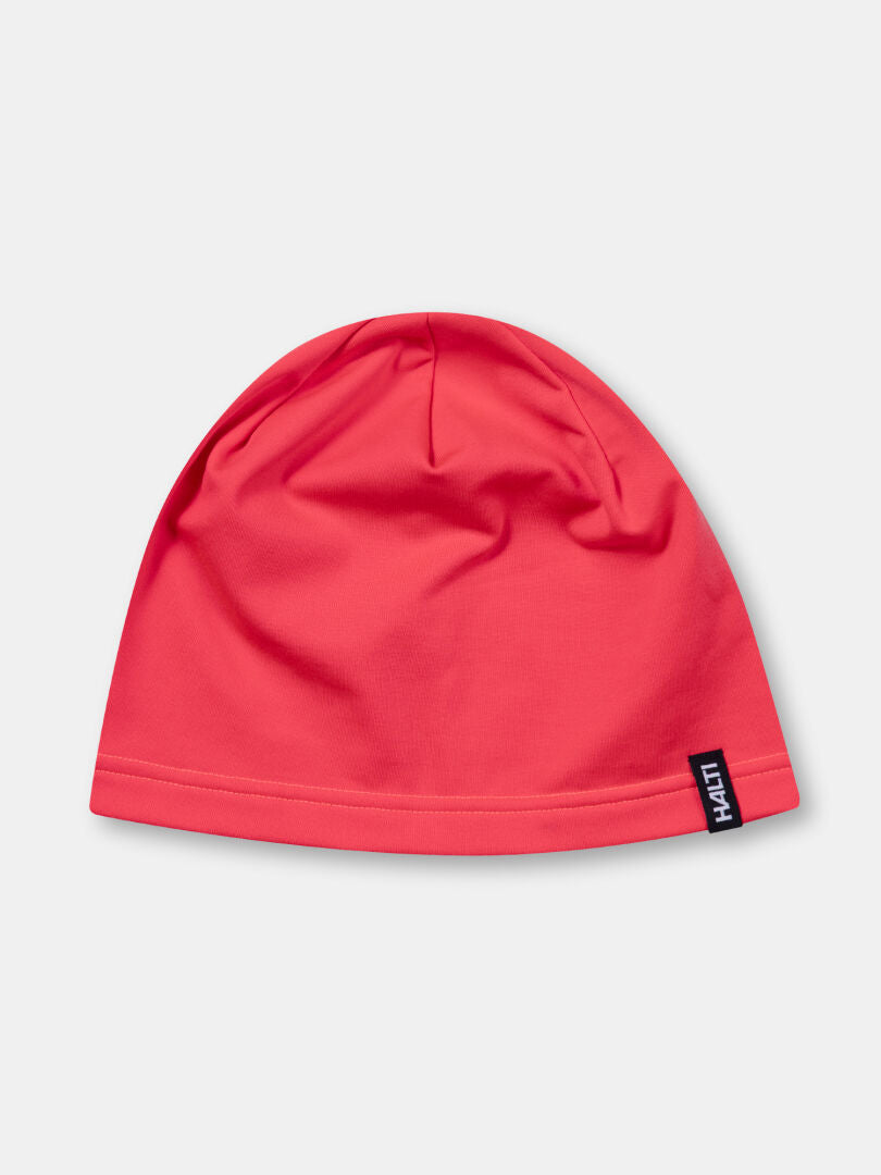 The Loiva Beanie by Halti is a plain pink technical knit with a HATTI tag, made from recycled polyester for training.