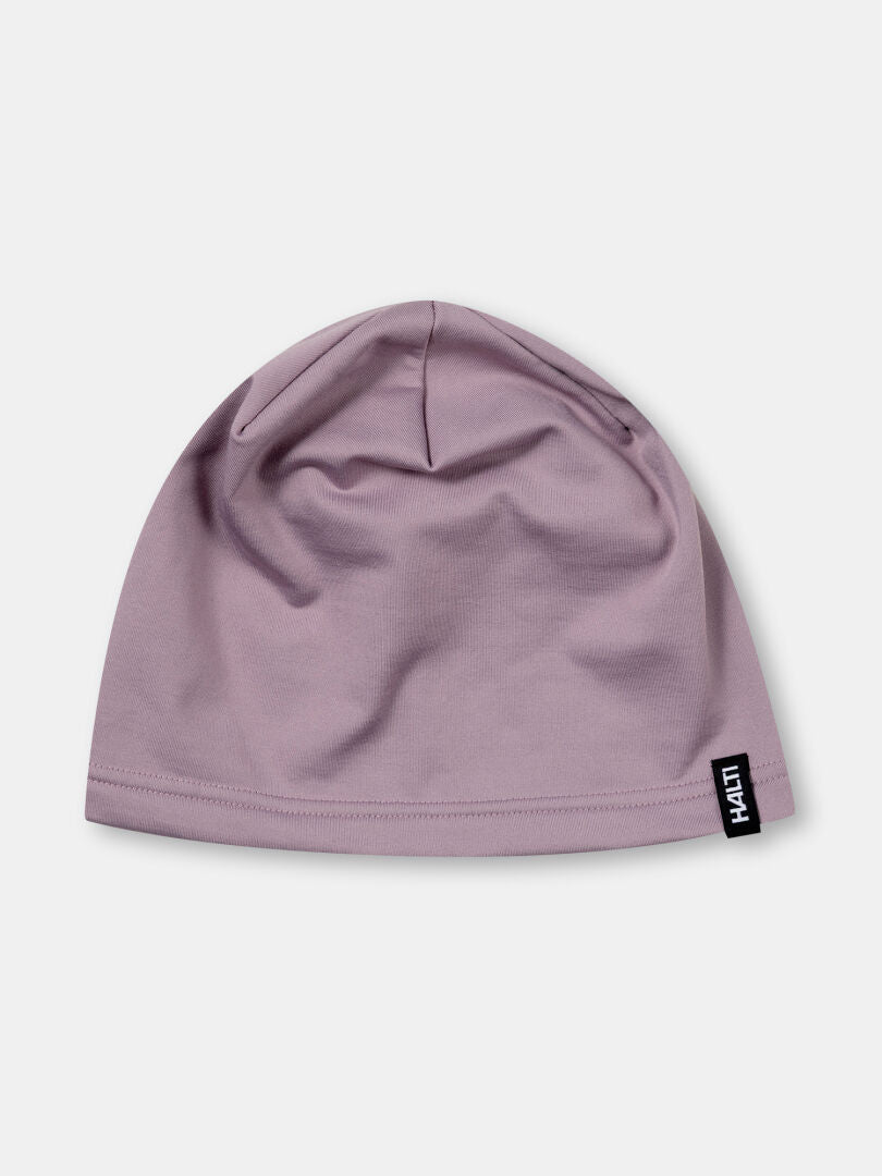 Halti Loiva Beanie in light purple technical knit with black label, made from recycled polyester, on white background.
