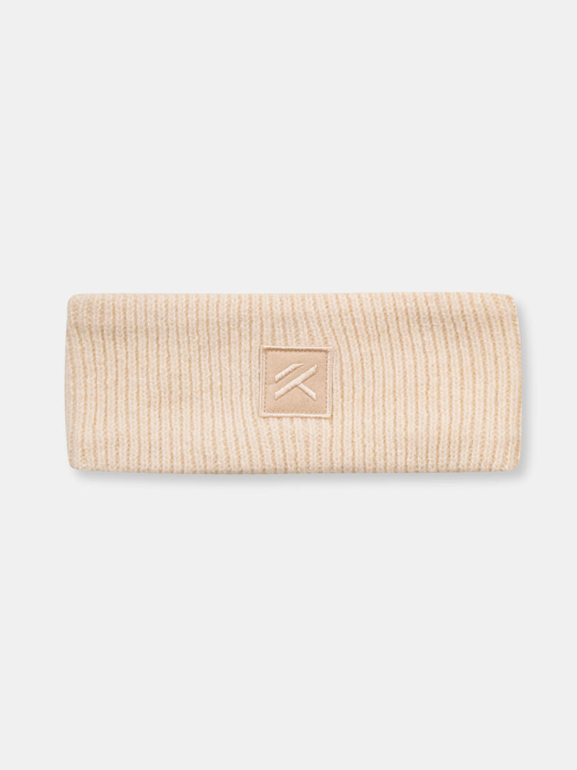 Halti Huurre Headband: Beige wool knit ear warmer with a minimalist logo patch, ideal for winter.