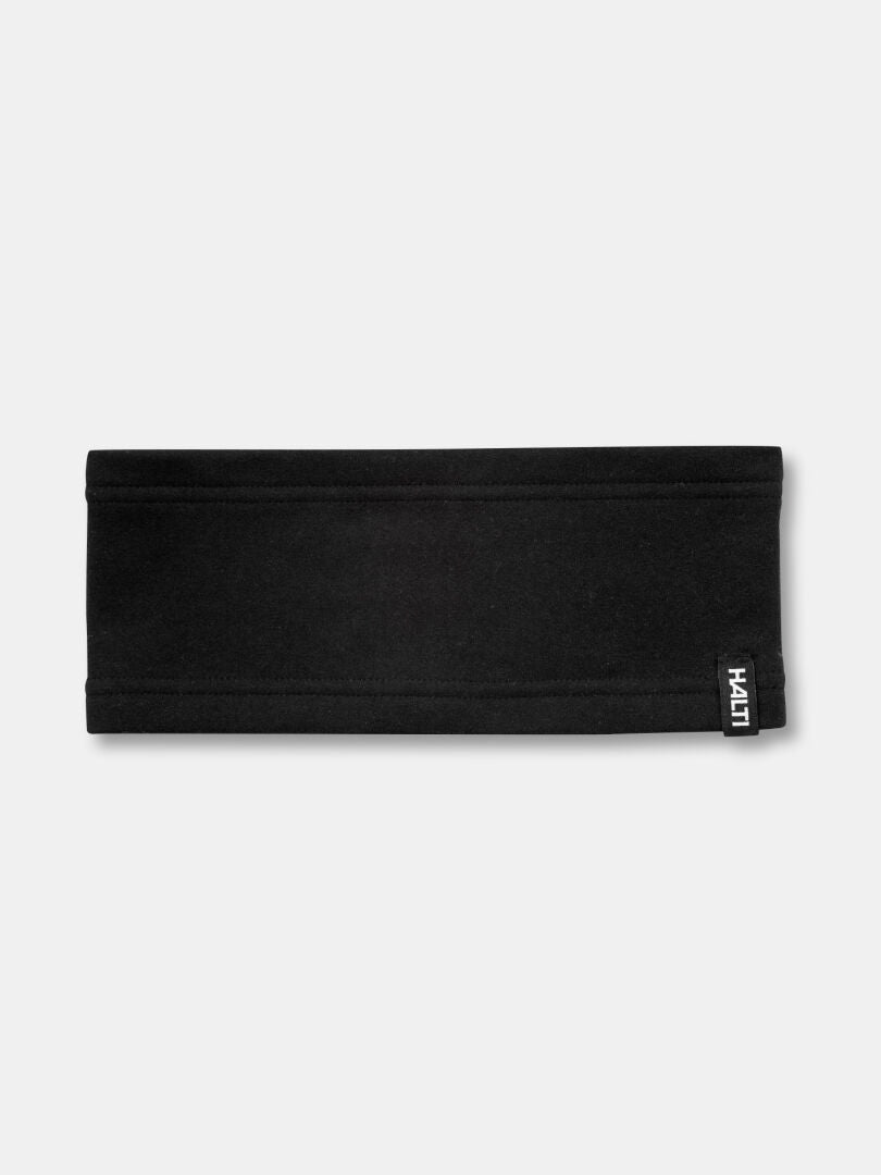 The Halti Trone Fleece Headband is flat, black, and features a small white logo tag on the bottom right edge.